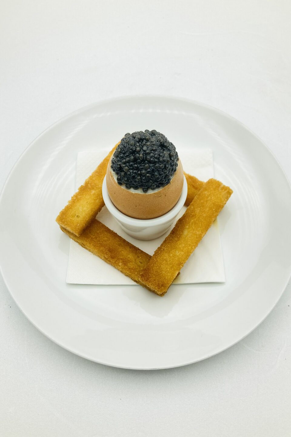 Organic softboiled egg, toasted country bread, caviar-min