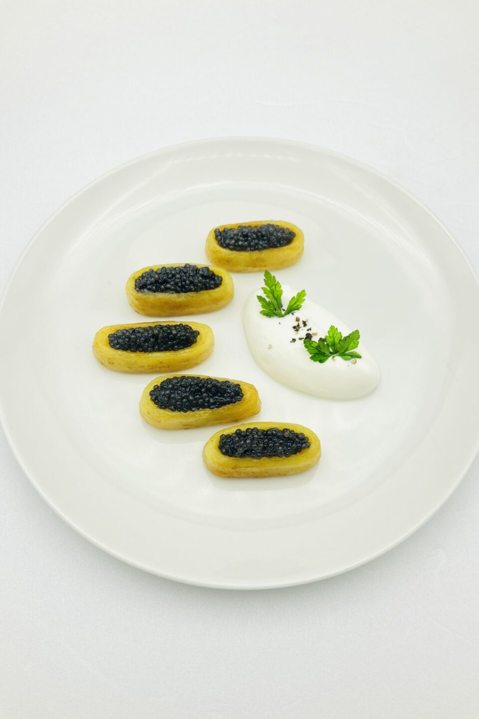 Warm fingerling potatoes, sour cream, caviar-min